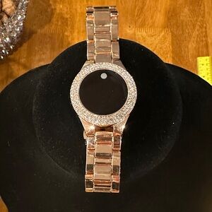 Elegant Rose Gold Women's Watch with Crystal encrusted bezel.